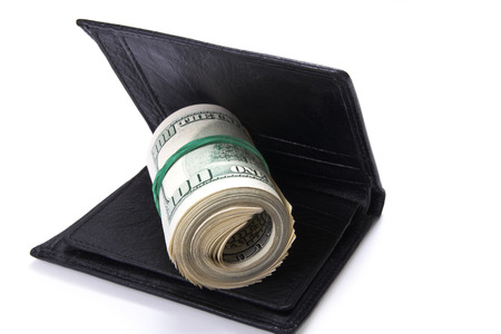 leather wallet with money, isolated on white background, selective focusの写真素材