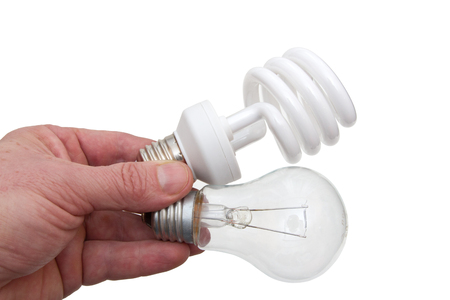 Hand with two electrobulbs on a white backgroundの写真素材