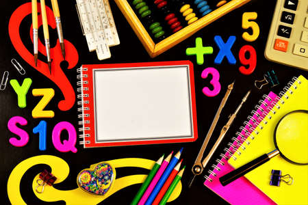 School stationery frame, student Desk, back to school. Opportunity to learn new knowledge and education. Notebooks, pencils and pens for writing and drawing, abacus for mathematics.の写真素材