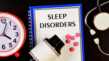 Sleep disorders-text label on the medical folder. The diagnosis was made by a doctor. Treatment procedures medications.の写真素材