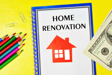 Home renovation-text inscription in the planning notebook. Colored pencils for drawing. Money to Finance the work project.の写真素材