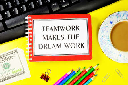 Teamwork makes the dream work - a text message in a Notepad on the computer keyboard. The business planning strategy will ensure financial well-being.の写真素材