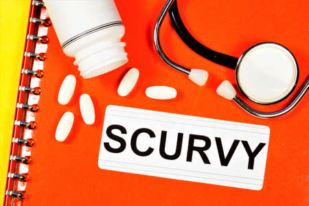 Scurvy-text inscription on a medical folder. Diagnosis by a doctor. Medication treatment.の写真素材