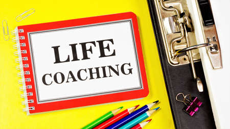 Life coaching-a text message in a Notepad. The method of consulting and training is practically used to achieve certain professional goals.の写真素材