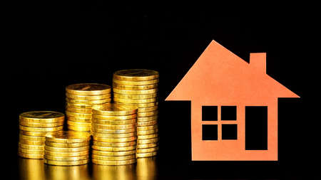 Stack of money coins, the assessment of the condition of the property. Financial success of investment strategy planning.の写真素材