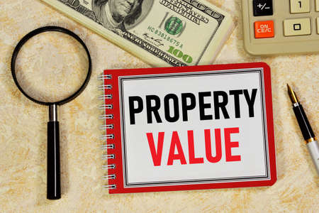 Property value. Text label in the research planning Notepad. Study and assessment of the state of secondary real estate.の写真素材