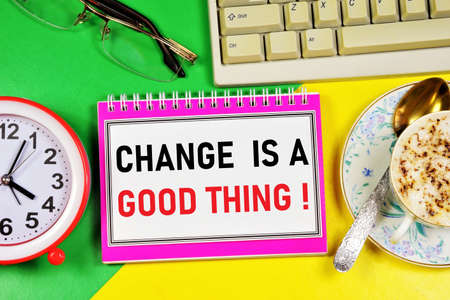 Change is a good thing. Text caption in the to-do planning Notepad. The clock is a symbol of time, a reminder of the past and the future. Overcome obstacles, set goals and workの写真素材