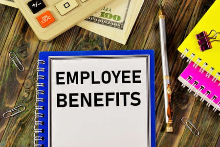 Employee benefits - text inscription in the planning form on the background of office supplies. Benefits, additional rights, remuneration, incentive payments.の写真素材