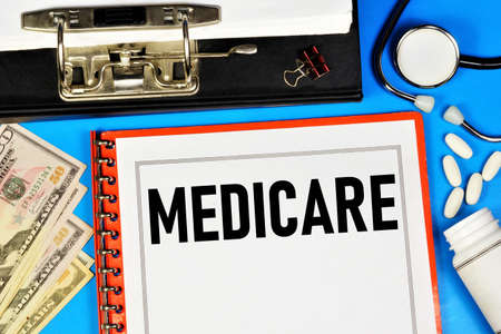 Medicare - text label in the office Registrar's folder. Insurance program, payment for medical care.の写真素材