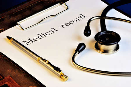 Medical records and stethoscope. Medicine - the science that studies the disease, preventing and leading them to a successful outcome. Doctors treat disorders of body parts with the help of hygiene products and prescribing drugs inside and outside or surgery.の写真素材