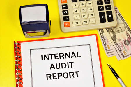Internal audit report. Text label in the financial document on the folder. Conducting financial control over the correctness of the company's activities and its assessment.の写真素材