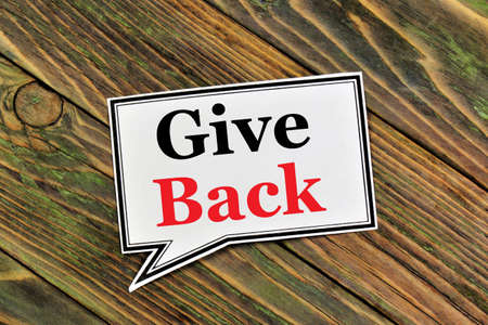 Give back. Text label. Getting back what was received or lost earlier.の写真素材