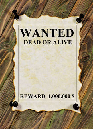 Wanted, dead or alive. The reward of $ 1,000,000. Text inscription on a Vintage grunge texture poster on a wooden wall background.の写真素材
