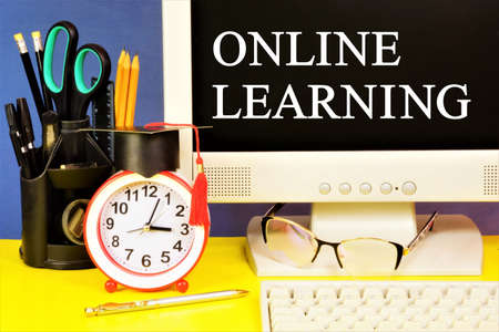 Online learning. Text message on the computer monitor. Electronic information technologies for...