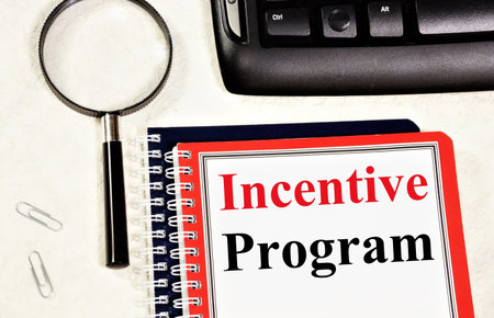 Incentive program. Text label in the planning notebook. A method of rewarding employees for effective work.の写真素材