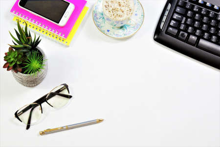 Manager's office desk, working background. Computer keyboard, notebooks for planning business...