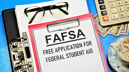 FAFSA. Free application for federal student aid. A text label in the planning folder. Financial assistance in the form of grants, loans and funds for work and study.の写真素材