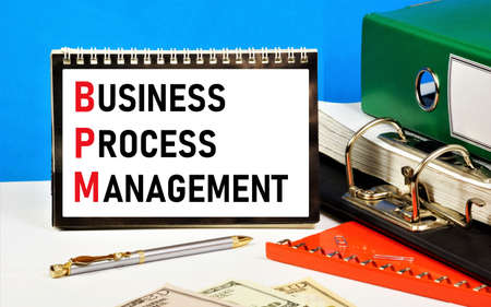 Business process management. The text label in the planning notebook. The system of administration of the organization in order to optimize the risks in the overall marketing strategy.の写真素材