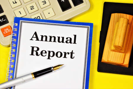 Annual report. The text label in the business plan notepad. Expresses a reliable opinion of the correctness of the company's activities and its assessment.の写真素材