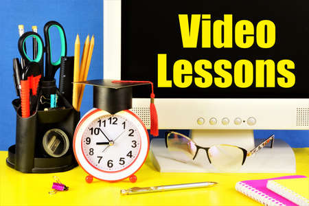 Video lessons. Text label on the monitor screen. Remote training with the help of computer telecommunications technologies.の写真素材