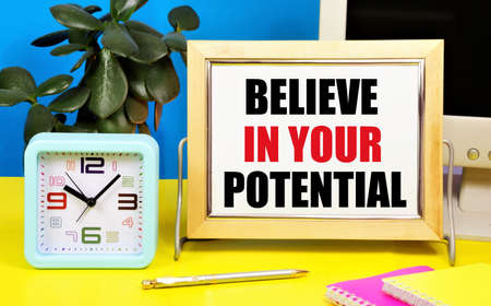 Believe in your potential. Motivational text inscription for inspiration in the notebook of planning future events, waiting for favorable results.の写真素材