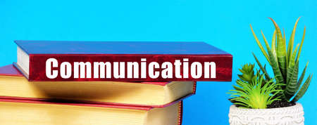 Communication. Text inscription on the book. Active interaction of information exchange.の写真素材