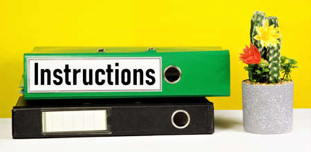Instructions. A text label on the document folder. The content of the rules, the establishment of the order and method of execution, the regulations, the powers and duties of the working staff.の写真素材