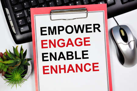 Empower engage enable enhanced. The label in the planning folder. The concept of business administration, broad participation of employees in the company's activities.の写真素材