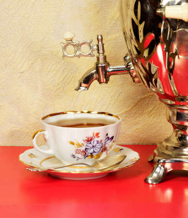 A samovar and a cup of tea. The personification of well-being, family comfort. A place of honor on the table.の写真素材