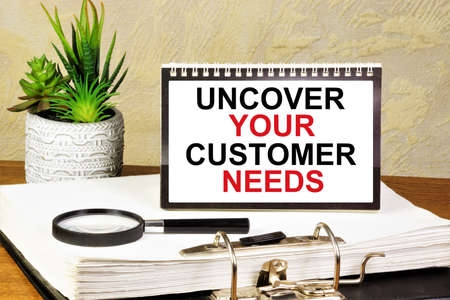 Uncover your customer needs. The inscription in the plate.の写真素材