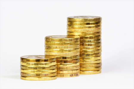 Stacks of money coins in ascending order. Financial success chart of profit strategy planning.の写真素材