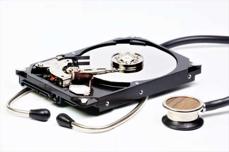 HDD and stethoscope. The internal device of the hard drive is ready for diagnosis and repair....