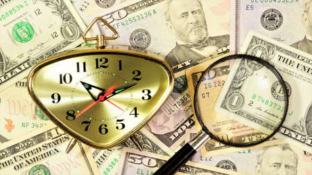 Time and money. The concept of expressing the value of various services and goods. Watch help in business planning to achieve a goal, magnifying glass for research.の写真素材