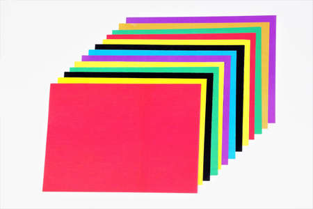 Colored sheets of paper for origami craft, festive decoration design and school harmonious creativity.の写真素材