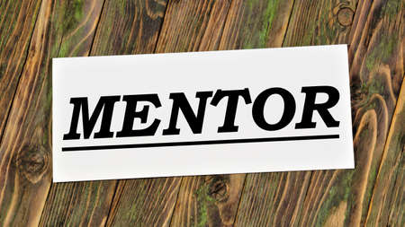 mentor. The inscription on the plate. Business coaches, consultants, managers consult and make decisions.の写真素材