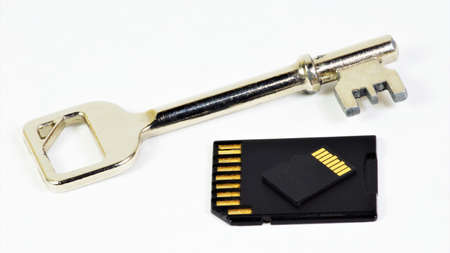 Key and computer memory cards. The concept of protecting access to information.の写真素材