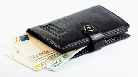Euro cash and wallet, a means of payment for goods and services. isolated on a white background. The concept of a financial well-being strategy.の写真素材