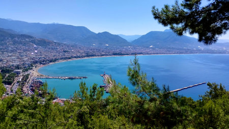 Photo of the view of the sea and the city from the mountainsideの写真素材