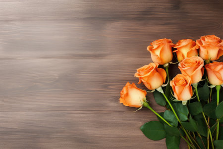 Bouquet of beautiful orange roses on wooden background, top viewの素材