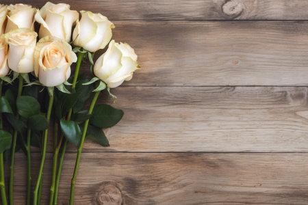 Bouquet of white and yellow roses on a wooden background.の素材