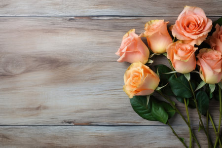 Bouquet of orange roses on a wooden background with copy spaceの素材