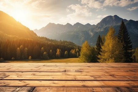 Wooden floor against mountain landscape with fir trees and meadow at sunsetの素材