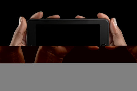 Hands holding a tablet professional photographyの素材