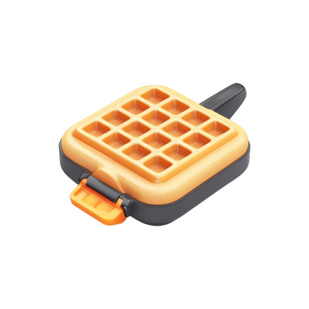Small, portable waffle iron with an orange handle and a detailed, square waffle pattern. The iron is a light beige color and has a black border.の素材