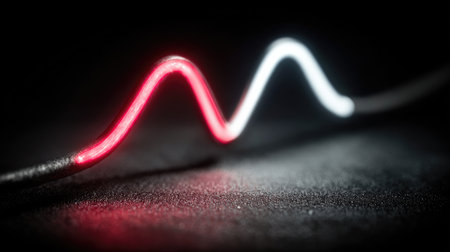 A vibrant abstract image featuring a neon light wave in red and white against a dark backdrop.の素材