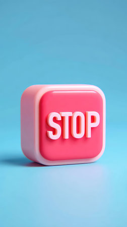 A pink cube with the word STOP on it, set against a blue backdrop.の素材