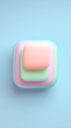 A top-down view of layered pastel squares on a light blue surface, creating a minimalist aesthetic.の素材