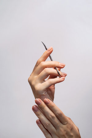 In female hands, manicure scissors close-upの写真素材