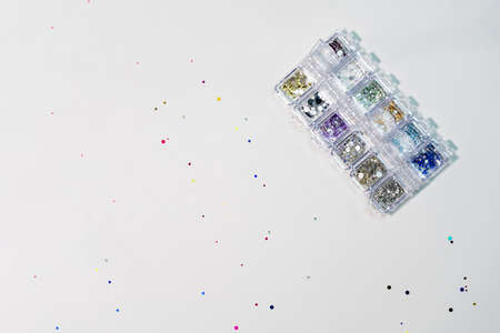 Manicure design tools. Multi-colored sequins, srazy, pebbles.の写真素材