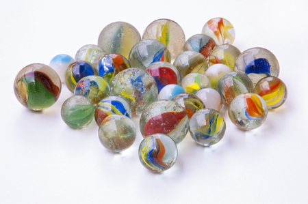 Colorful marbles isolated on whiteの写真素材